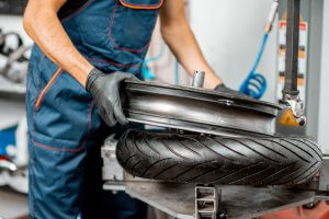 Breaking the bead of a motorcycle tire